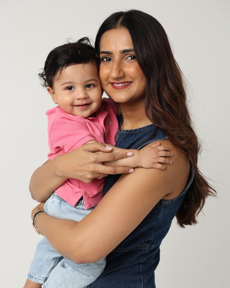 Aditi, founder of First Nivala, holding her son Aaryan